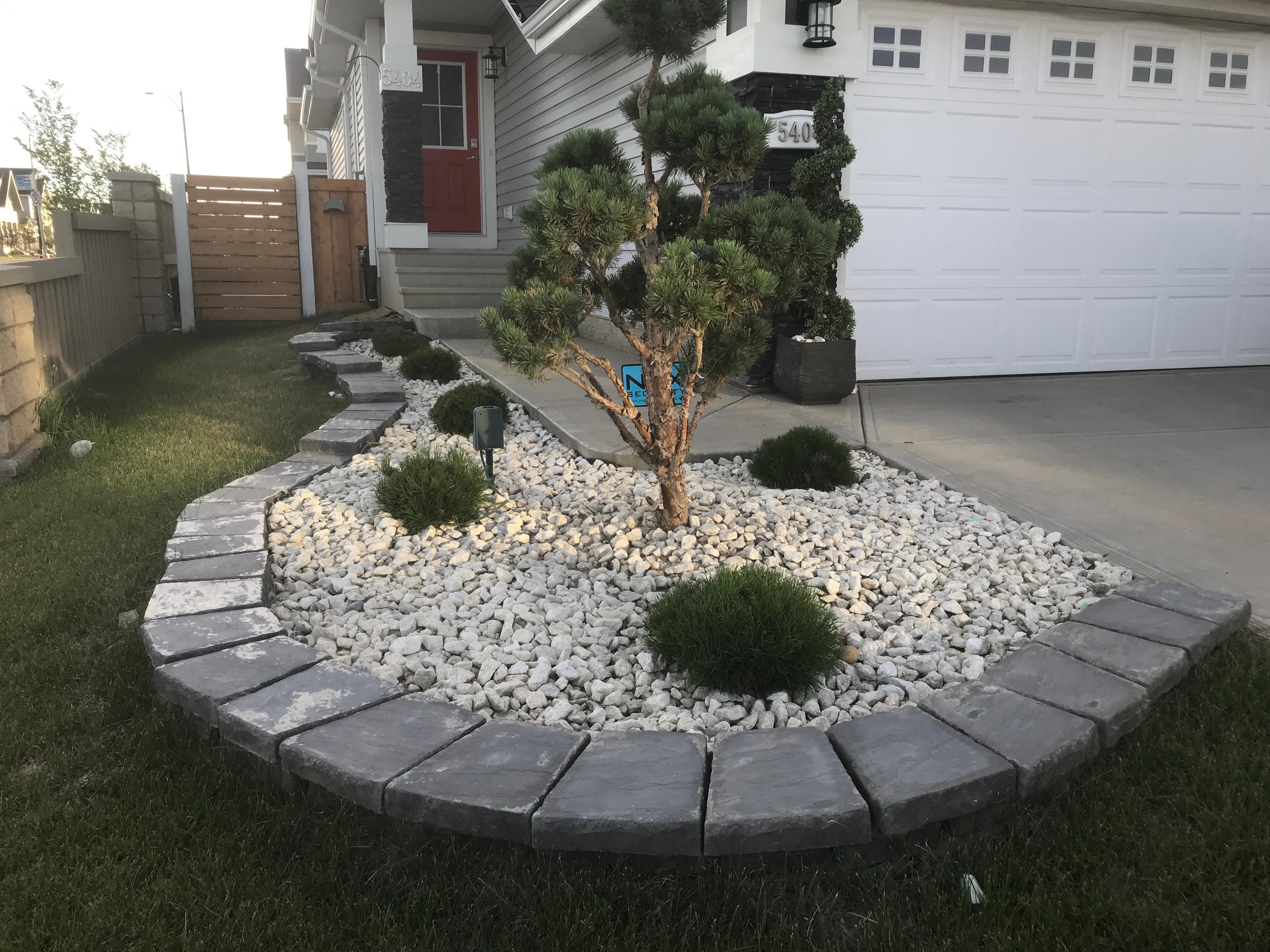 ALA Landscaping completed landscape design - curved garden island with white rock and ornamental trees